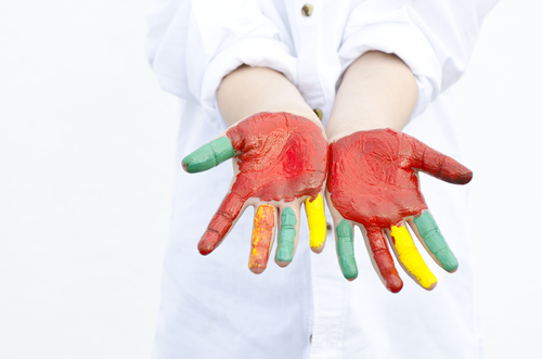 boy with hands painted